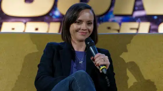Christina Ricci holding a microphone at a convention appearance in February 2020