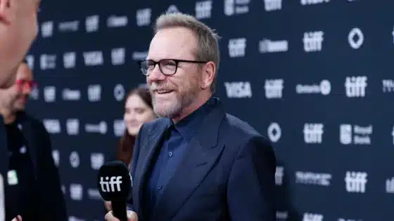 Kiefer Sutherland smiling during an interview at the Toronto International Film Festival in September 2024